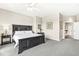 Spacious bedroom featuring a large bed, plush carpeting, and elegant decor for a relaxing retreat at 720 S Rangeline Rd # 703, Carmel, IN 46032