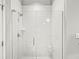 Modern walk-in shower with white subway tile, glass door, and sleek hardware; perfect for a spa-like experience at 720 S Rangeline Rd # 703, Carmel, IN 46032