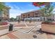 Beautifully designed town center with decorative flower arrangements, fountains, and inviting outdoor spaces for a pleasant experience at 720 S Rangeline Rd # 703, Carmel, IN 46032