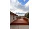 Spacious outdoor deck adjacent to house, perfect for relaxation and enjoying the backyard views at 7332 Jackie Ct, Indianapolis, IN 46221