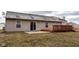 A spacious yard and outdoor back deck, adjacent to sliding glass door and patio at 7332 Jackie Ct, Indianapolis, IN 46221