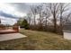 Large yard featuring an outdoor back deck, a storage shed and plenty of space at 7332 Jackie Ct, Indianapolis, IN 46221