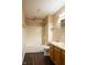 Bathroom featuring a shower-tub combo, vanity with sink, and wood-look flooring at 7332 Jackie Ct, Indianapolis, IN 46221