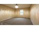 Bedroom with carpet flooring, neutral paint, and one window at 7332 Jackie Ct, Indianapolis, IN 46221