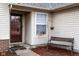 Charming covered front porch featuring space for seating and a secure screened entry door at 7332 Jackie Ct, Indianapolis, IN 46221