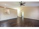 Bright living area with hardwood flooring, decorative ceiling fan, and open doorway at 7332 Jackie Ct, Indianapolis, IN 46221