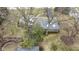Aerial view of the home with mature trees and a long driveway leading up to the home at 7481 Holliday E Dr, Indianapolis, IN 46260