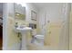 Bright bathroom featuring tile flooring, updated vanity, toilet, and shower with curtain at 7481 Holliday E Dr, Indianapolis, IN 46260