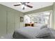 Cozy bedroom with lots of natural light, closet, and an inviting bed at 7481 Holliday E Dr, Indianapolis, IN 46260
