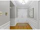 Inviting foyer featuring hardwood floors, neutral walls, and classic trim at 7481 Holliday E Dr, Indianapolis, IN 46260