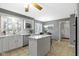 Bright kitchen with white cabinets, quartz countertops, modern appliances and island at 7481 Holliday E Dr, Indianapolis, IN 46260