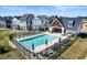 Aerial view of the community pool surrounded by lounge chairs and manicured lawn at 753 Madelyn Dr, Carmel, IN 46032
