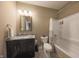Well-lit bathroom featuring a granite vanity, a bathtub with a shower, and modern fixtures for comfortable living at 839 N Park Trail Dr, Carmel, IN 46032