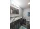 Stylish bathroom featuring a granite countertop, a modern vanity, and sleek black fixtures for a contemporary look at 839 N Park Trail Dr, Carmel, IN 46032
