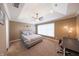 Cozy bedroom with a tray ceiling, a ceiling fan, and a comfortable bed, creating a relaxing retreat at 839 N Park Trail Dr, Carmel, IN 46032