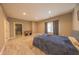 Spacious bedroom with wood-look floors, a large window, and a walk-in closet for convenient storage at 839 N Park Trail Dr, Carmel, IN 46032