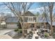 Aerial view of the back of the home featuring a patio with a seating area, grill, shed, and lush trees at 9132 Log Run N Dr, Indianapolis, IN 46234
