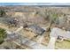 An aerial view of a single Gathering home showcasing it's landscaping, driveway, and surrounding neighborhood at 9132 Log Run N Dr, Indianapolis, IN 46234