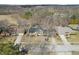 An aerial view of a single Gathering home displaying its landscaping, driveway, and street at 9132 Log Run N Dr, Indianapolis, IN 46234