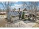 Back exterior featuring a balcony, patio with grill, and well-manicured lawn at 9132 Log Run N Dr, Indianapolis, IN 46234