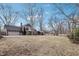 Beautiful home exterior showcases a large lawn, patio with outdoor furniture, and well-maintained landscaping at 9132 Log Run N Dr, Indianapolis, IN 46234