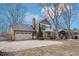 Charming back exterior features a balcony, patio, well-manicured lawn, and ample parking space at 9132 Log Run N Dr, Indianapolis, IN 46234