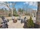 Cozy backyard with a stamped concrete patio and inviting fire pit surrounded by comfortable Adirondack chairs at 9132 Log Run N Dr, Indianapolis, IN 46234