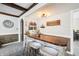 Basement bar featuring stone accents, custom lighting and a 