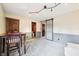 Finished basement space with carpet, a barn door, and versatile potential for various uses at 9132 Log Run N Dr, Indianapolis, IN 46234