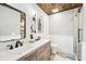 Modern bathroom featuring double sinks, wood accents, and a white shiplap wall at 9132 Log Run N Dr, Indianapolis, IN 46234