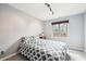 Cozy bedroom features wainscoting and a window bringing in natural light above a comfortable bed at 9132 Log Run N Dr, Indianapolis, IN 46234