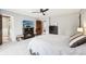 Bedroom boasting a fireplace, a TV on the wall, a bed with patterned bedding and soft carpet at 9132 Log Run N Dr, Indianapolis, IN 46234