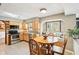 Sunlit breakfast nook featuring a bay window with cushioned seating and a wooden table set at 9132 Log Run N Dr, Indianapolis, IN 46234