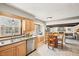 Well-lit kitchen with stainless steel appliances and a breakfast nook, bathed in natural light at 9132 Log Run N Dr, Indianapolis, IN 46234