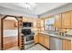 Functional kitchen featuring stainless steel appliances and ample cabinet space at 9132 Log Run N Dr, Indianapolis, IN 46234
