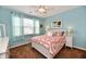 Bedroom with a ceiling fan and a large window allowing for an abundance of light at 9640 Clover Leaf Ln, Fishers, IN 46038