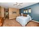Well-lit bedroom with warm neutral tones and plush carpeting at 9640 Clover Leaf Ln, Fishers, IN 46038