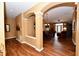 Open concept dining room with hardwood floors and stylish lighting at 9640 Clover Leaf Ln, Fishers, IN 46038