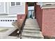 Inviting front entrance of home with steps and brick accents at 9640 Clover Leaf Ln, Fishers, IN 46038