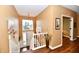 Inviting entryway with staircase, beautiful floors and natural light at 9640 Clover Leaf Ln, Fishers, IN 46038