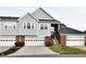 Inviting townhome with attached garages and a well-maintained lawn at 9640 Clover Leaf Ln, Fishers, IN 46038