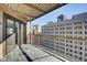 Apartment balcony offers city views with sliding glass doors and wrought iron railing at 110 E Washington St # 1102, Indianapolis, IN 46204
