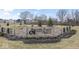 Elegant brick community entrance sign with manicured landscaping and decorative features at 11758 Harvester S Cir, Noblesville, IN 46060