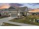 Charming home with a two-car garage and well-maintained lawn at 11758 Harvester S Cir, Noblesville, IN 46060