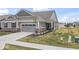 Charming home with a two-car garage and well-maintained lawn at 11758 Harvester S Cir, Noblesville, IN 46060