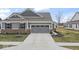 Charming home with a two-car garage, neat landscaping, and a welcoming driveway at 11758 Harvester S Cir, Noblesville, IN 46060