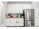 Well-organized kitchen with white cabinets, stainless steel appliances, and ample counter space at 11758 Harvester S Cir, Noblesville, IN 46060