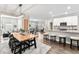 Open-concept living space with a modern kitchen, dining area, and comfortable seating at 11758 Harvester S Cir, Noblesville, IN 46060