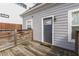 Home back yard with grey siding and a small deck, perfect for outdoor relaxation and entertaining at 1210 S State Ave, Indianapolis, IN 46203