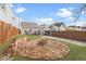 Charming backyard with a brick firepit and partial brick wall seating, perfect for outdoor enjoyment at 1210 S State Ave, Indianapolis, IN 46203